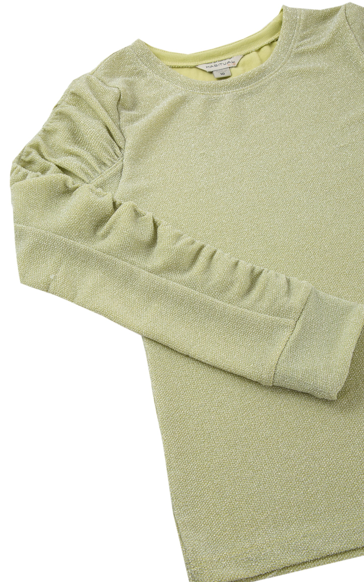 Close up of gathered, long sleeve of light green crewneck top with metallic accents.