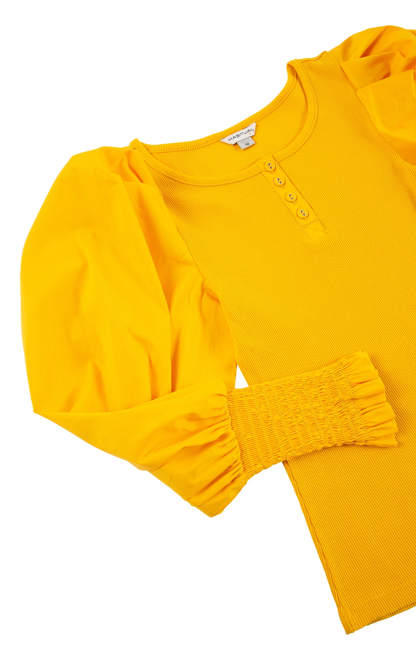 CLOSE UP OF YELLOW  LONG-SLEEVE TOP WITH FOUR BUTTONS AT THE COLLAR, PUFFY SLEEVES, AND SMOCKED CUFFS