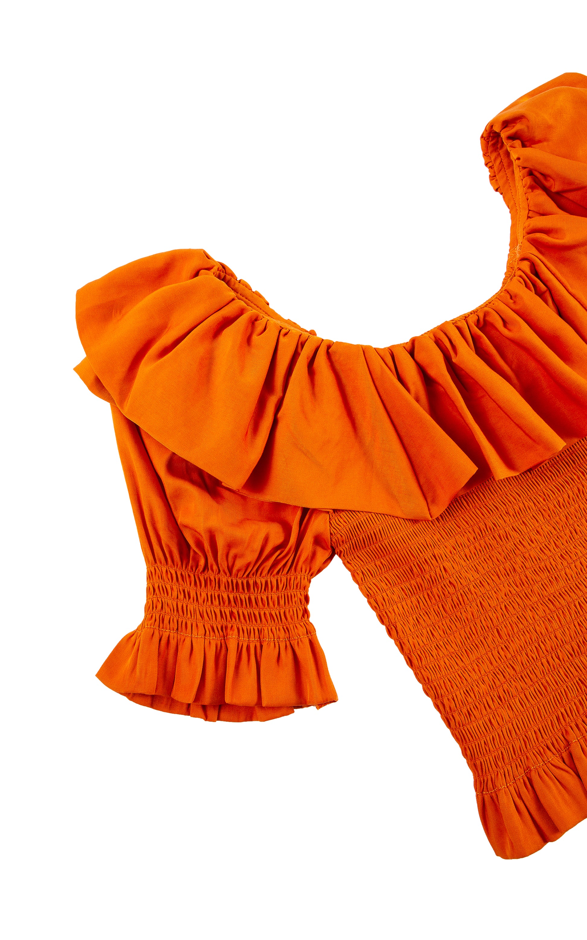 CLOSE UP OF ORANGE-RED THREE-QUARTER-LENGTH SLEEVE TOP WITH A WIDE RUFFLED NECKLINE AND A SMOCKED BODICE