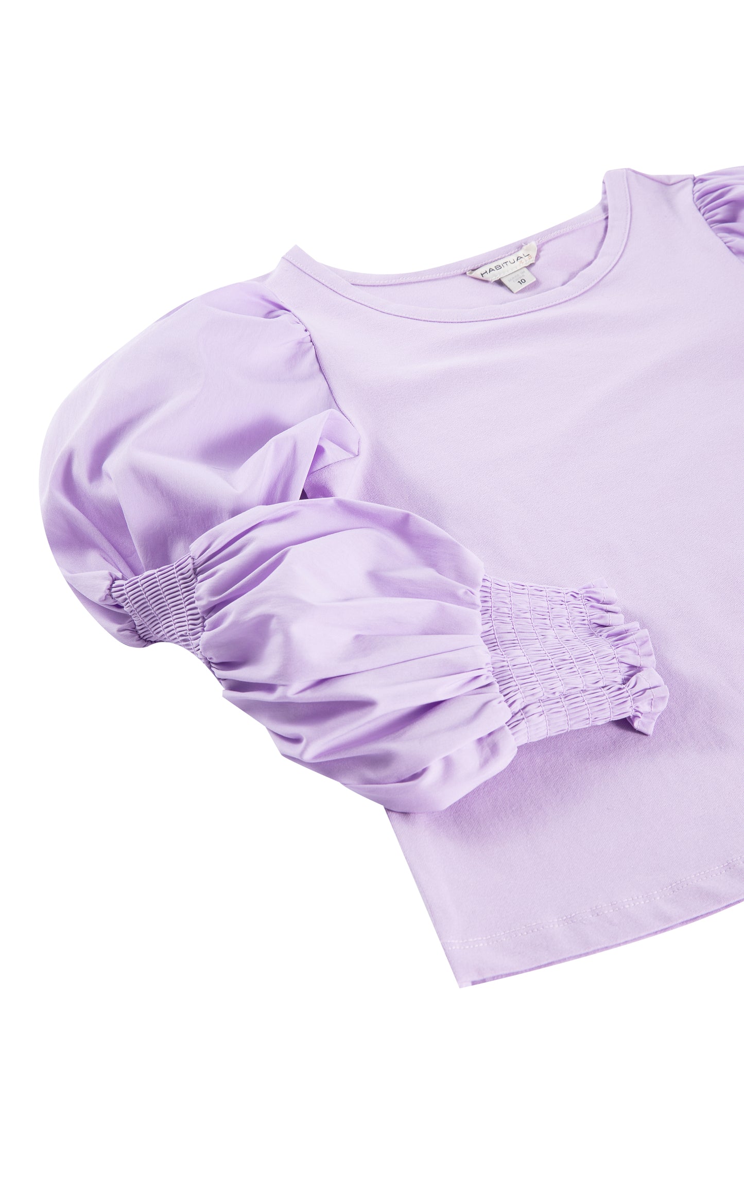 CLOSE UP OF LIGHT PURPLE LONG-SLEEVE TOP WITH SMOCKING ALONG THE SLEEVES