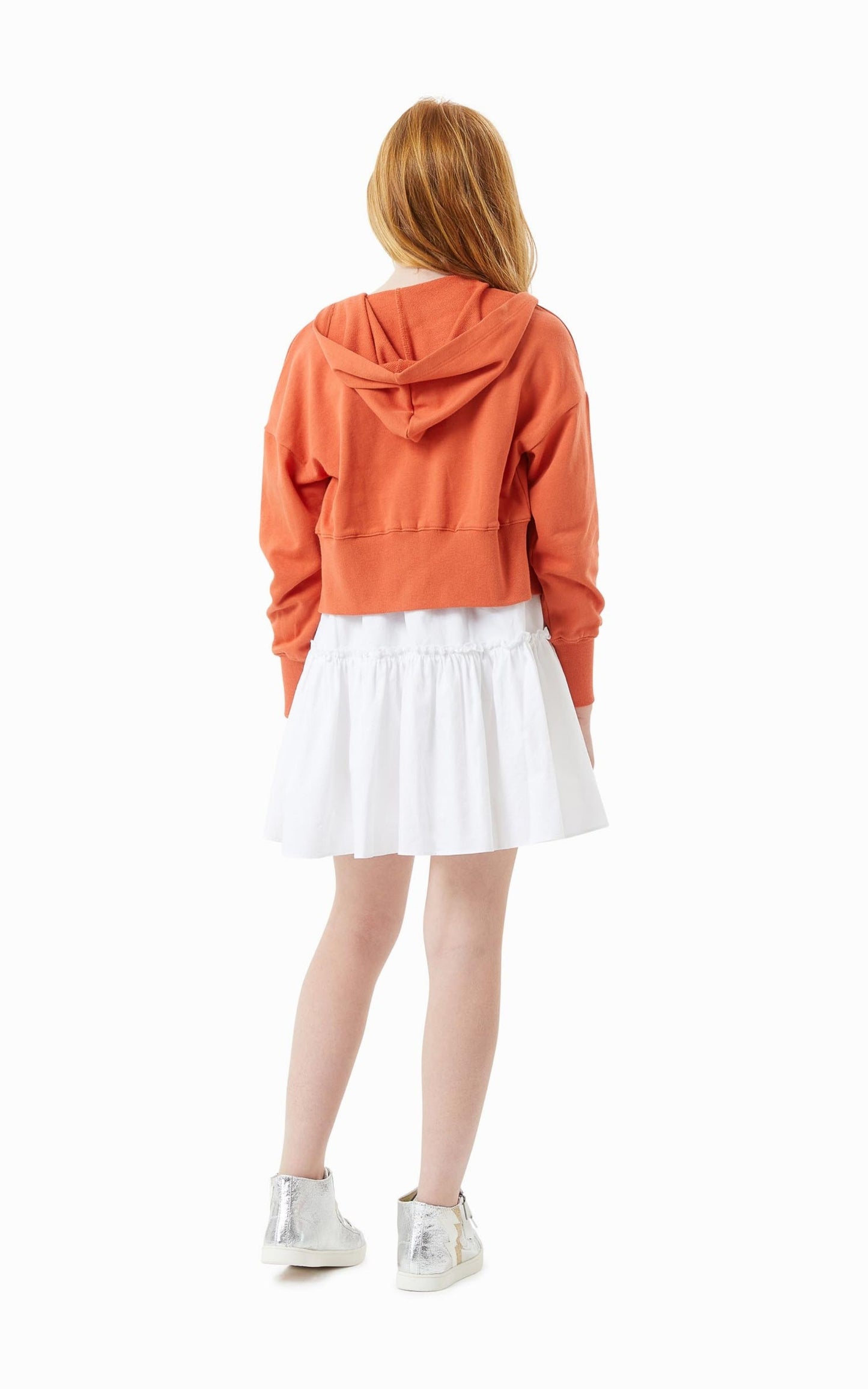 Back view Pre-teen Child in a White Mid-Thigh Summer Dress and Orange Zip up hoodie 