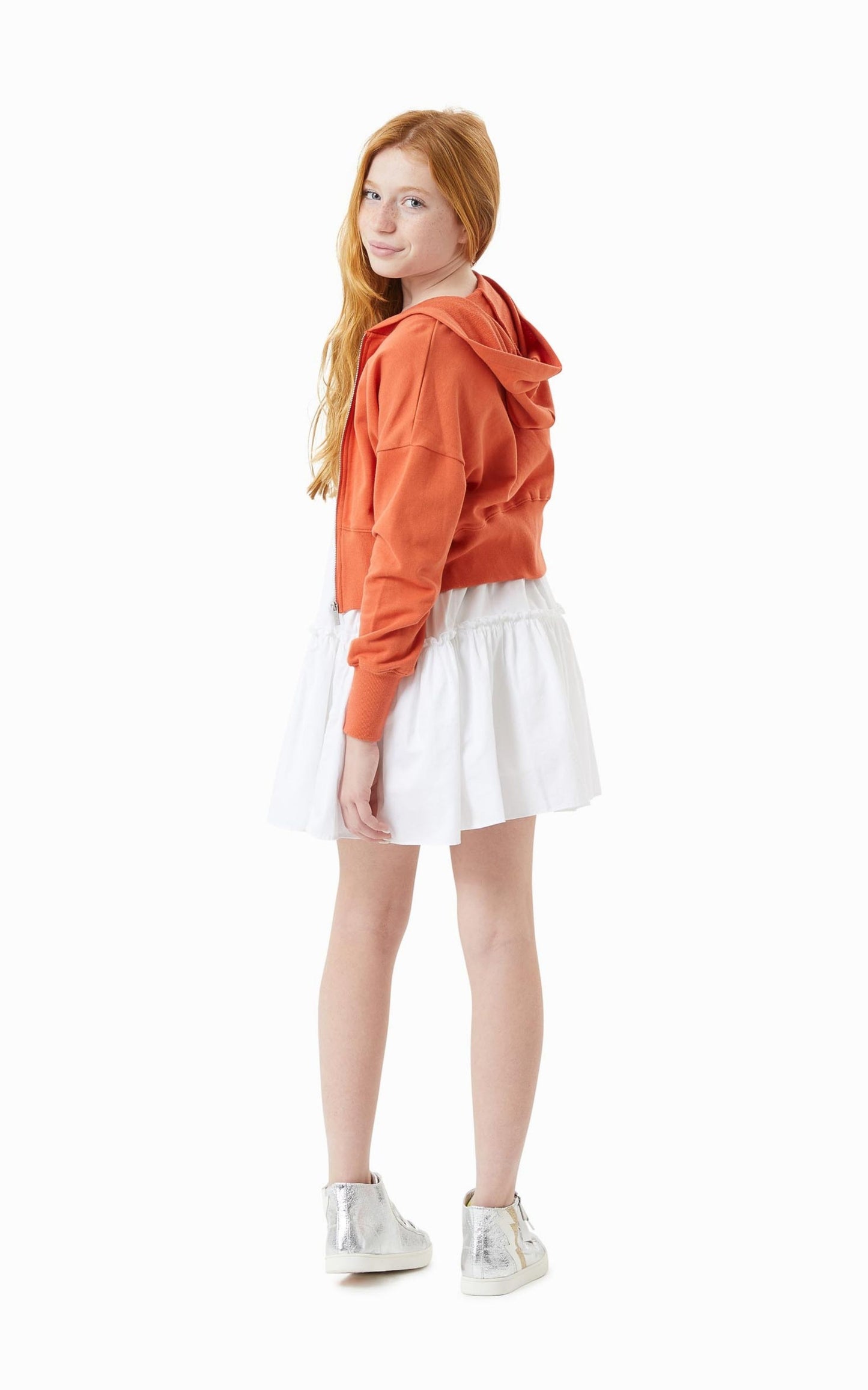 Pre-teen Child in a White Mid-Thigh Summer Dress and Orange Zip up hoodie 