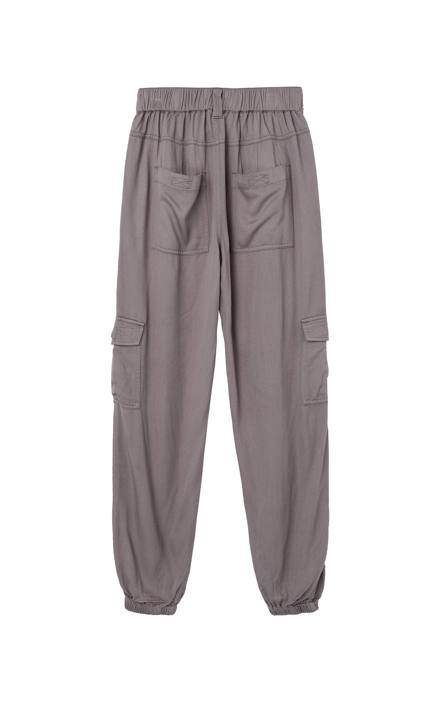 Back view of gray pants with cargo pockets, pleat accents, and elastic ankle cuffs. 