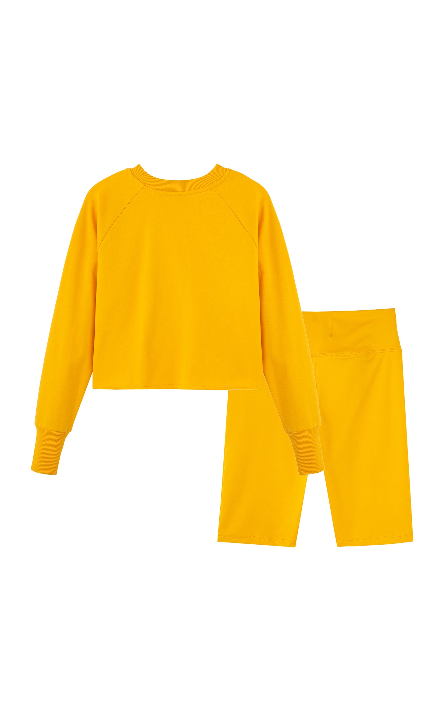 Back view of yellow long-sleeve, crewneck top with matching shorts.