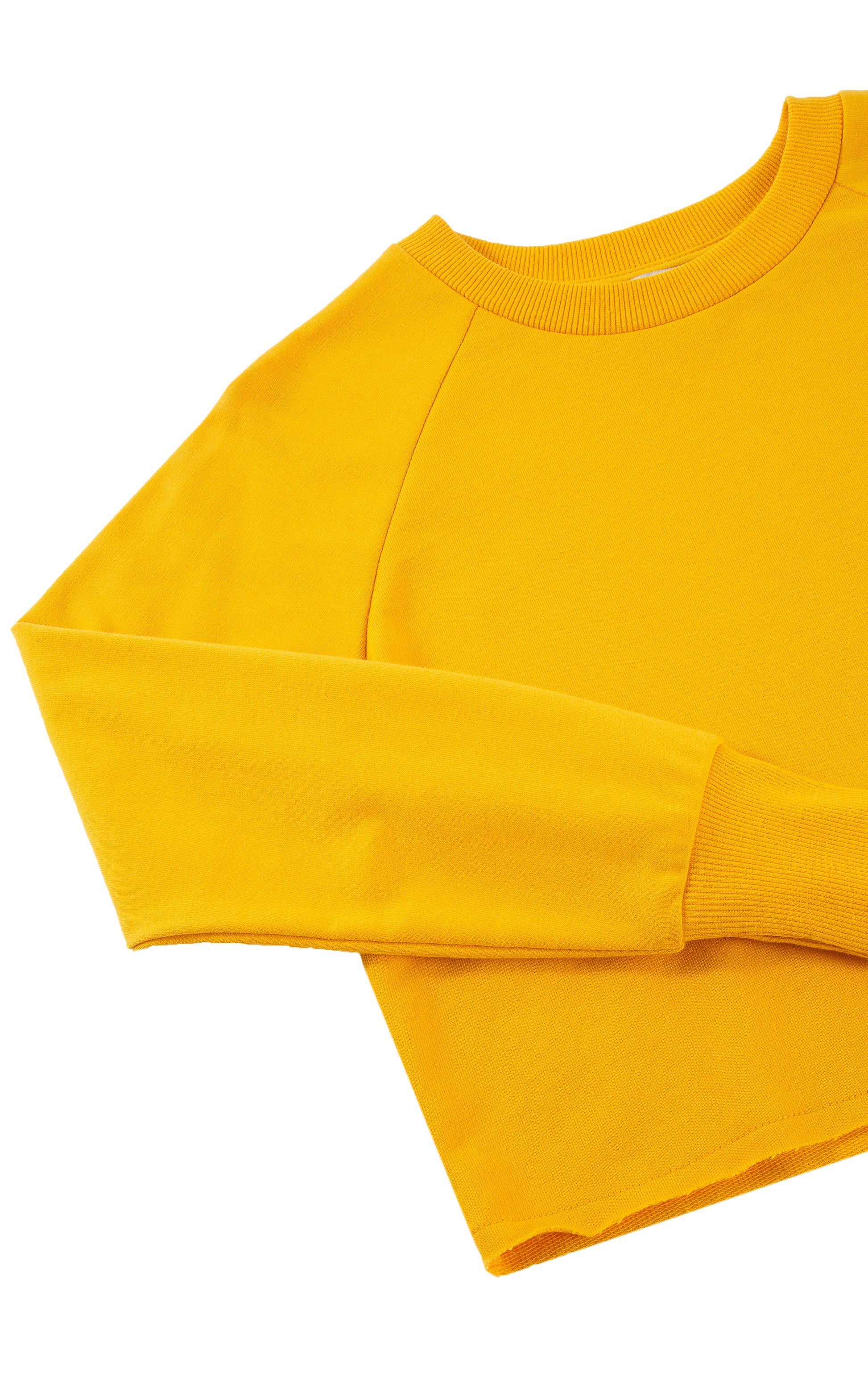 Close up of yellow long-sleeve, crewneck top.