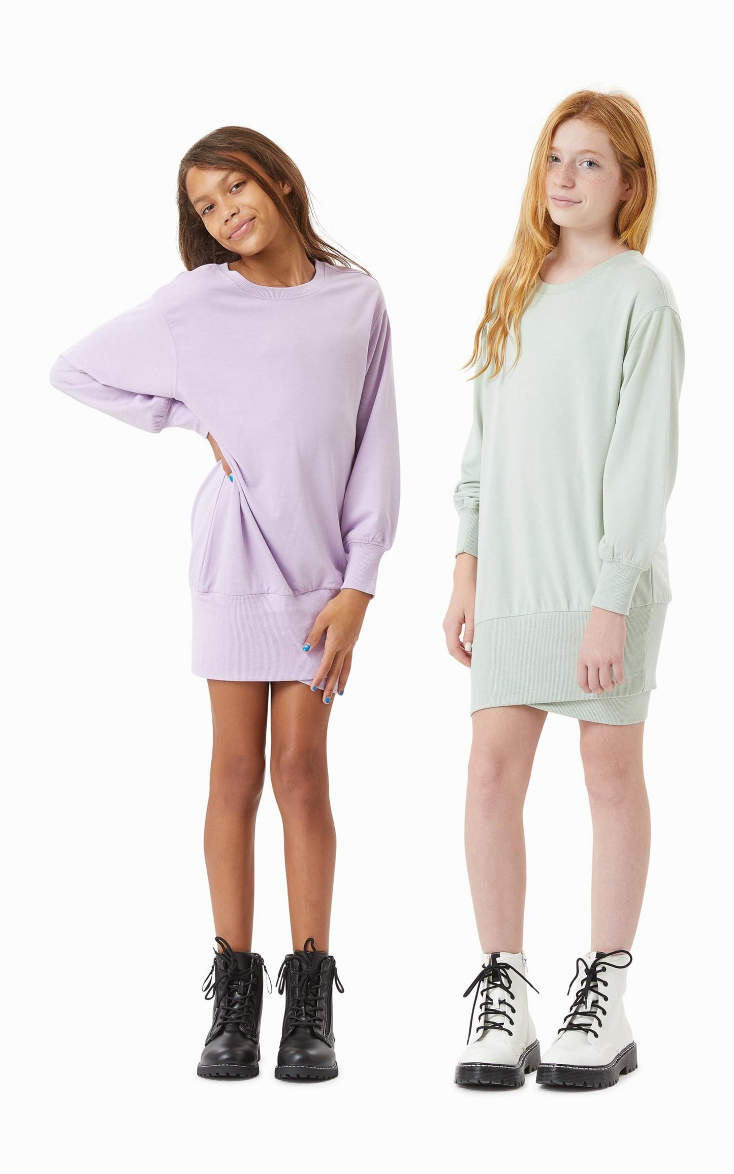 two teen girls wearing a purple and sage drop waist terry dress