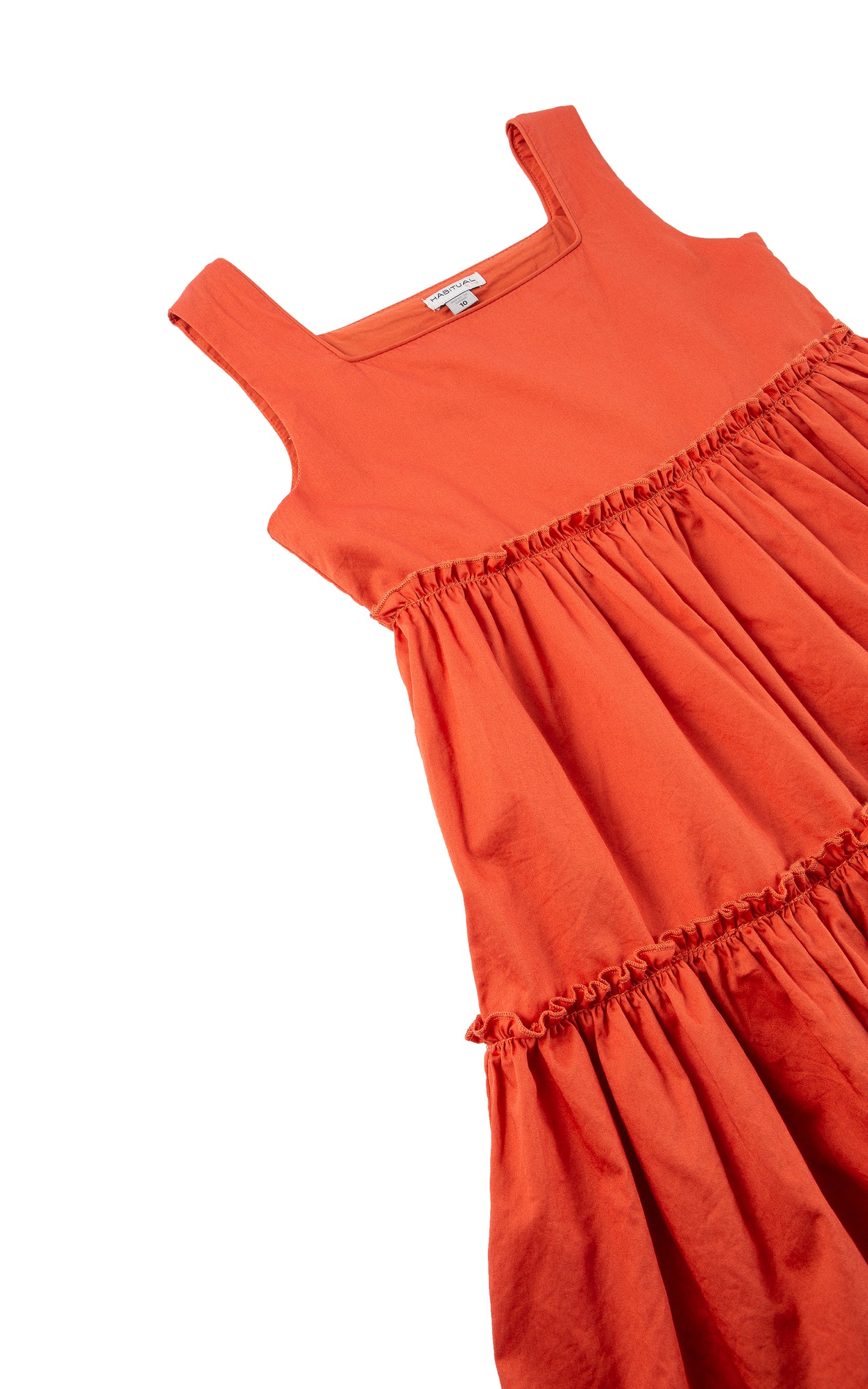 Close up of rust tiered baby doll dress