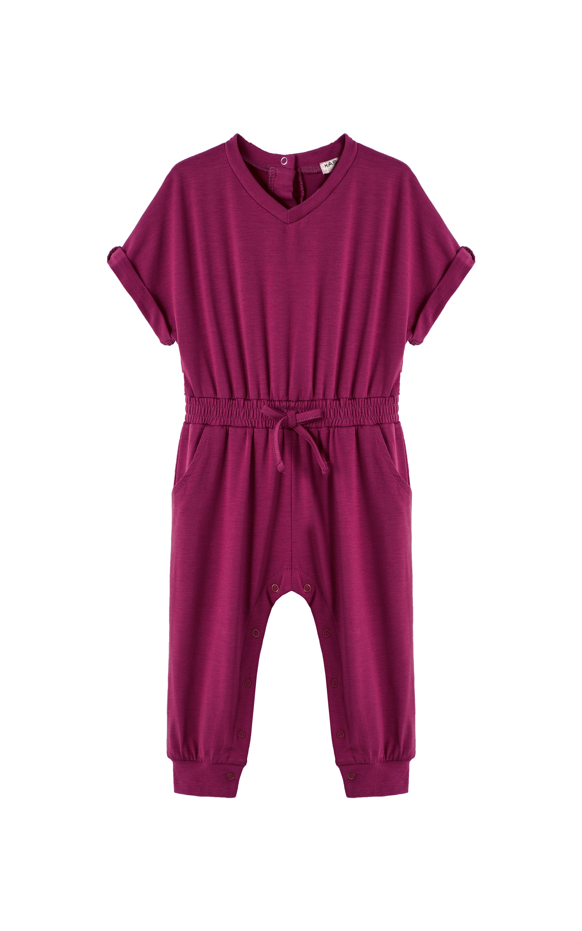 Plum-colored romper with folded cuff sleeves and tie at waist. 