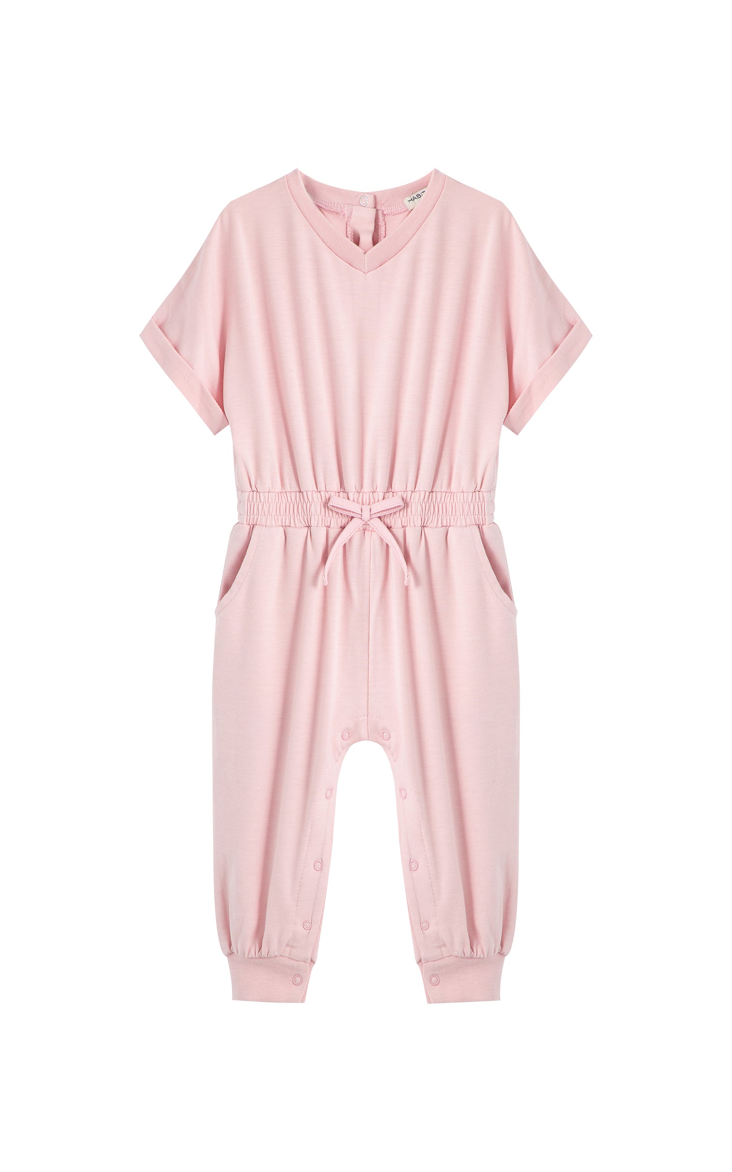 Pink romper with folded cuff sleeves and tie at waist. 