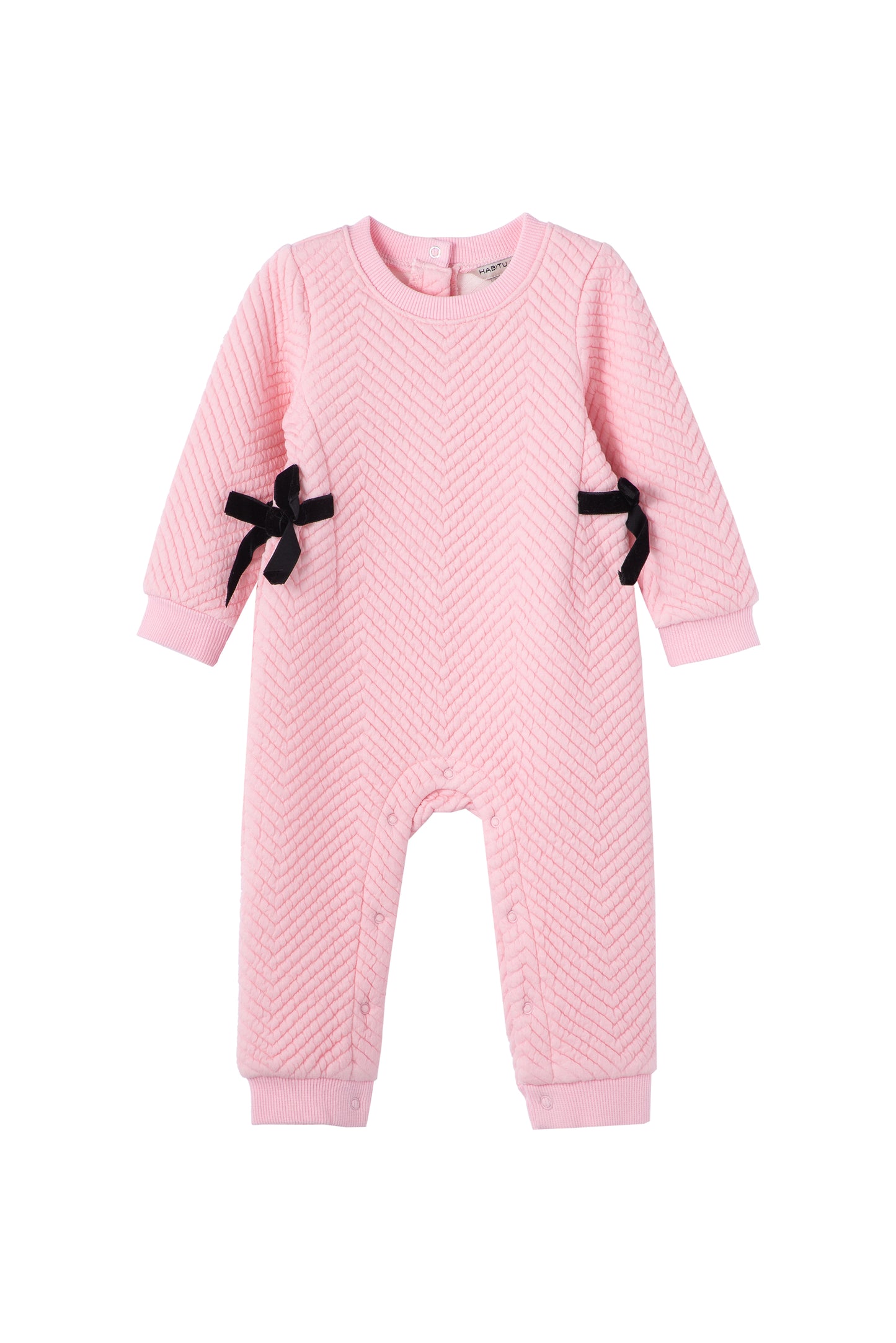 Front view of pink quilted jumpsuit with black side bows 