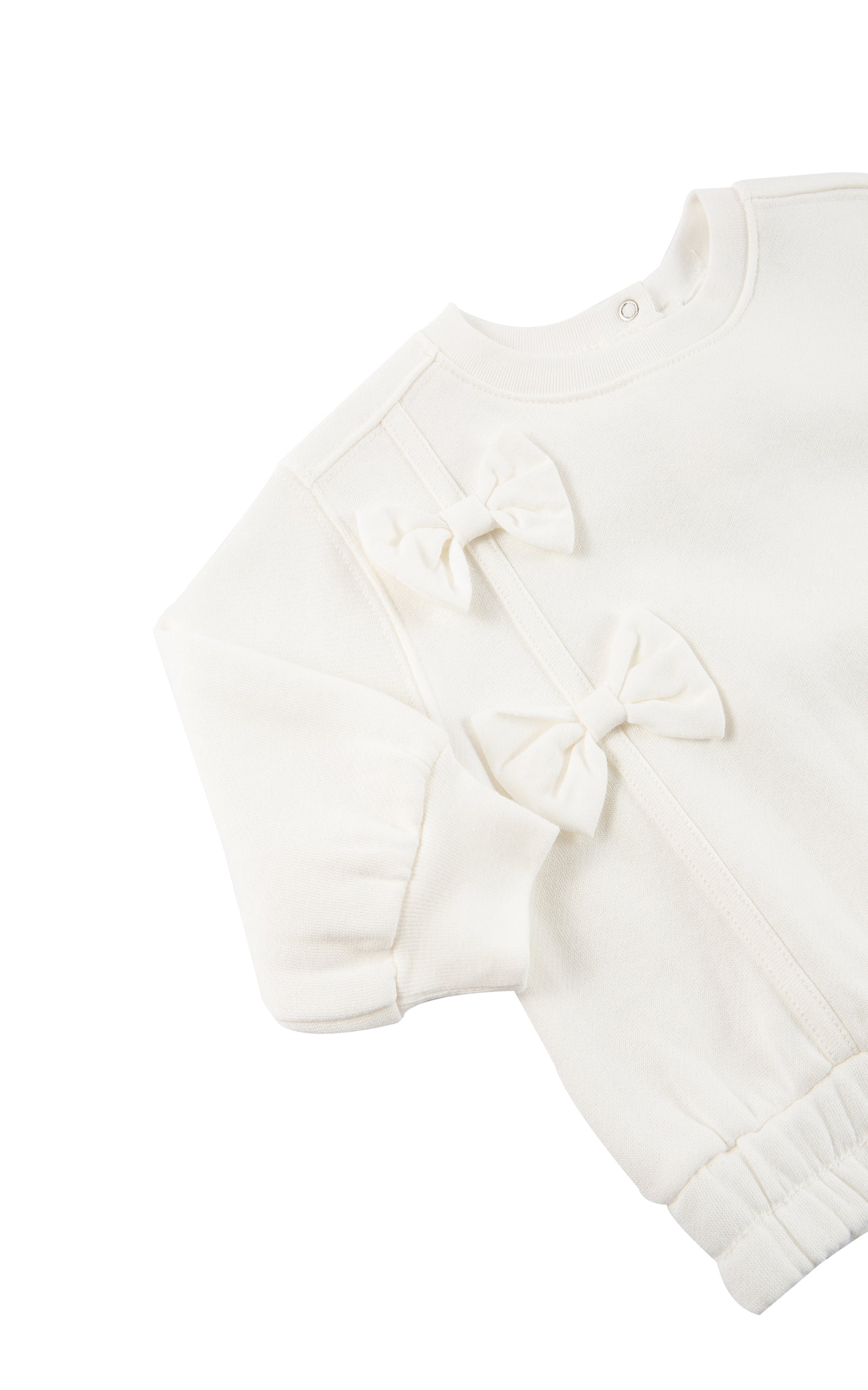 side view of off-white fleece sweatshirt with a bow 