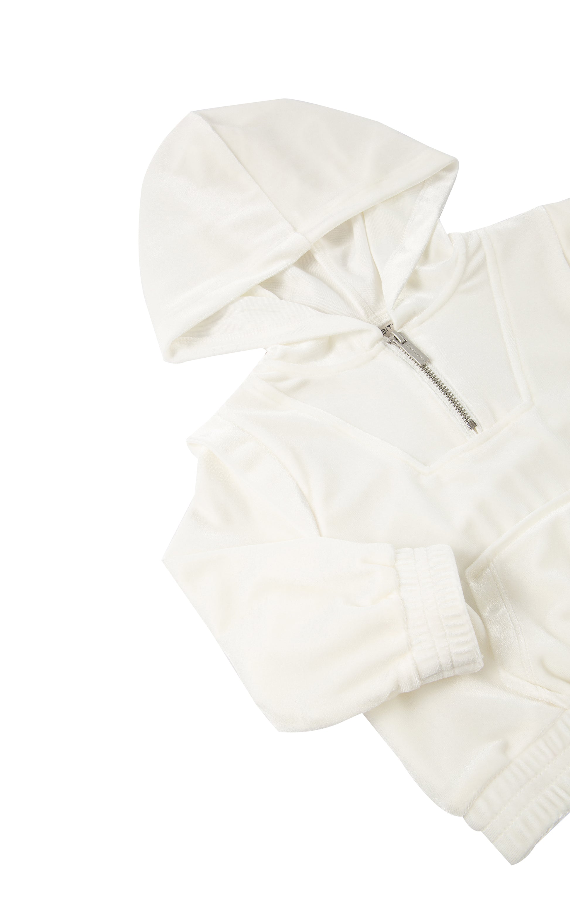 Detail view of an off-white velour tracksuit hoodie