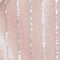 Swatch of pink with metallic stripe fabric.